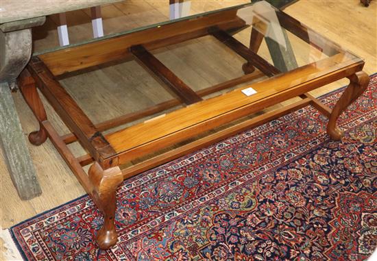 An Indonesian coffee table with bevelled glass insert W.114cm